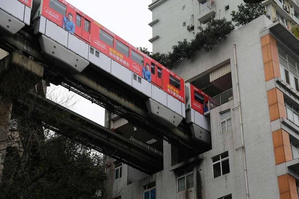 Incredible Train That Runs Between Apartment Buildings In China