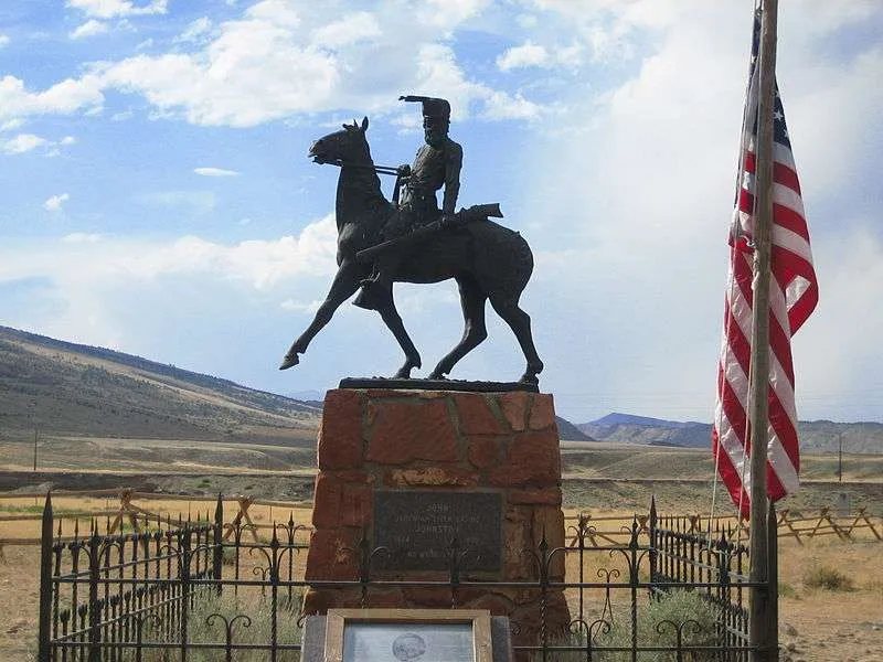 Bronze statue of Liver-Eating Johnson erected over his grave at Old Trail Town in Cody, Wyoming.