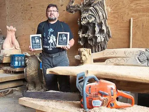 Igor Loskutow, an Estonian chainsaw master, carved a fascinating Dragon bench 2
