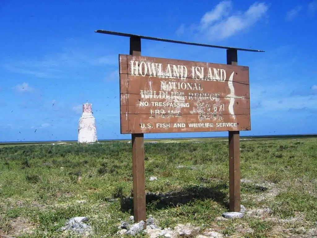 Howland Island, Earhart’s intended destination. in the distance is a small lighthouse, nicknamed 'earhart's light.'