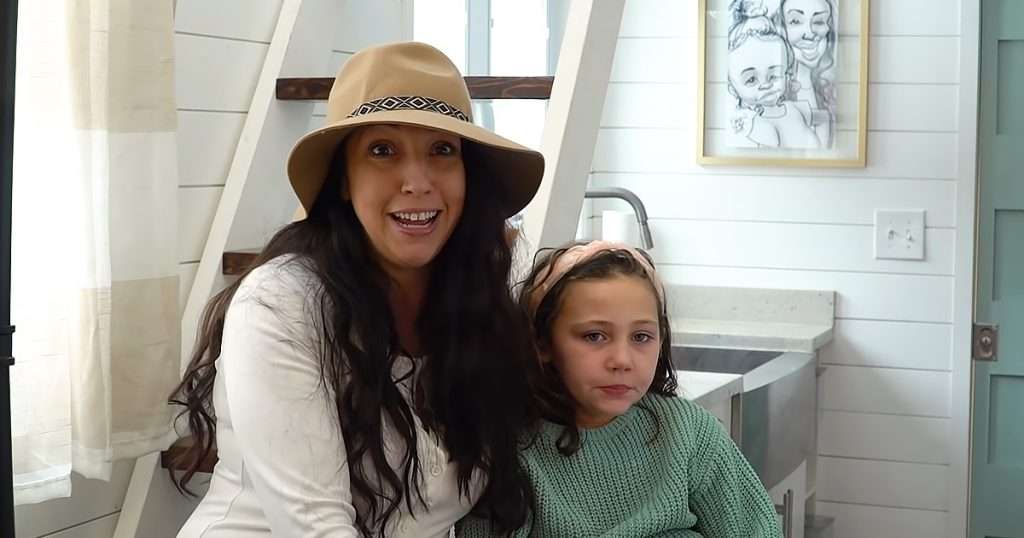 mother and daughter reside in their charming tiny house